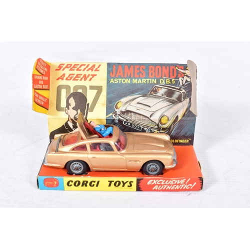 134 - A BOXED CORGI TOYS JAMES BOND ASTON MARTIN DB5, No.261, roof will not stay shut, front guns not work... 