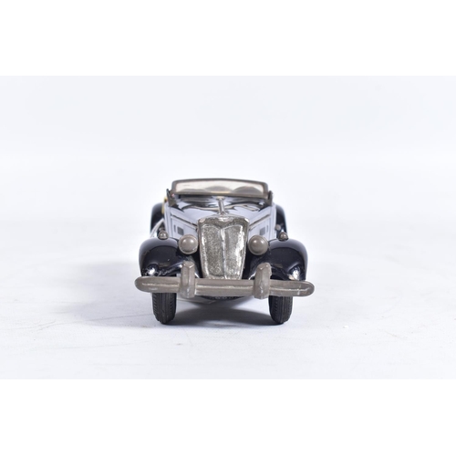 86 - AN UNBOXED BANDAI TINPLATE FRICTION DRIVE M.G. SPORTS CAR, black body with red interior, cream tonne... 