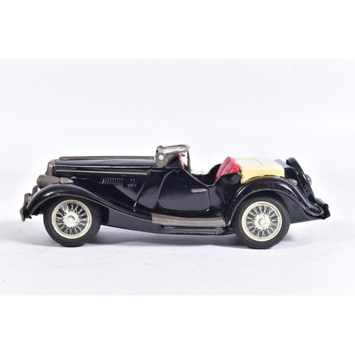 86 - AN UNBOXED BANDAI TINPLATE FRICTION DRIVE M.G. SPORTS CAR, black body with red interior, cream tonne... 