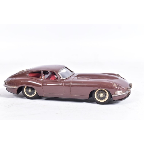 87 - AN UNBOXED NOMURA TINPLATE FRICTION DRIVE JAGUAR E TYPE, metallic blue body, red and white interior,... 