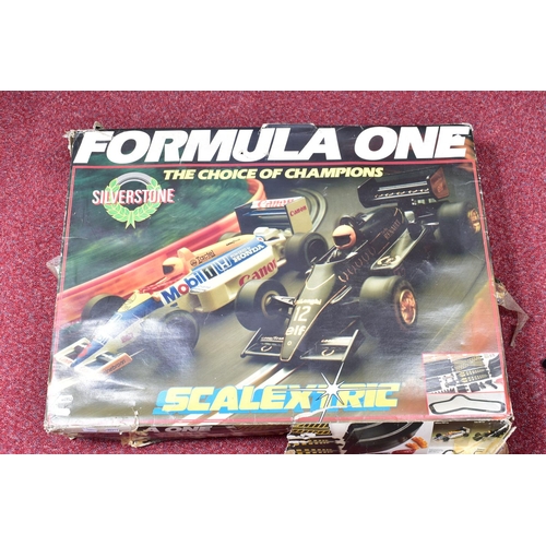 94 - TWO BOXED SCALEXTRIC FORMULA ONE MOTOR RACING SETS, one (C741) is complete with both cars, Lotus 98T... 