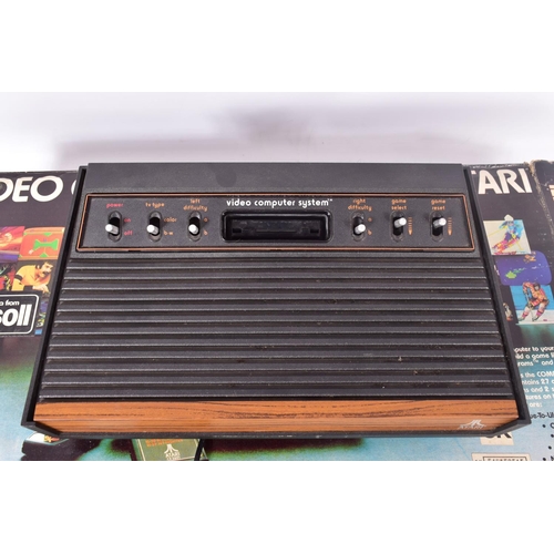 305 - A BOXED ATARI 2600, BOXED ATARI 2600 GAMES AND A TELESPORT GAME CONSOLE, boxed games include Space I... 