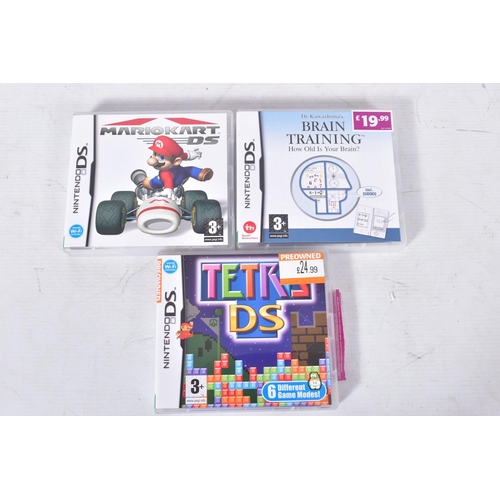 307 - A WHITE DS LITE COMPLETE WITH ITS BOX, includes a charger, Mario Kart DS, Tetris Ds and Dr. Kawashim... 