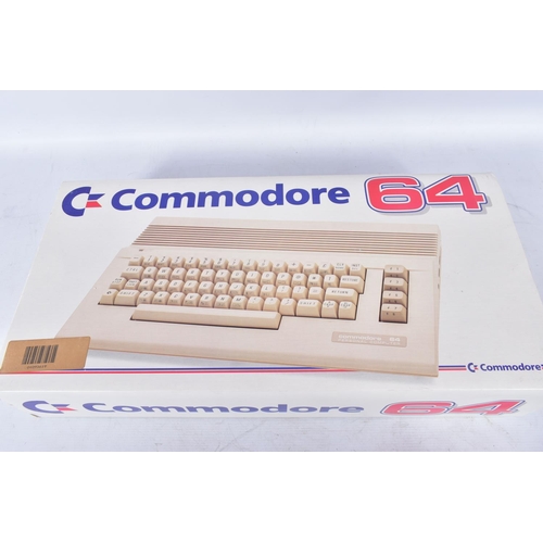 312 - COMMODORE 64C COMPUTER BOXED WITH A QUANTITY OF GAMES, computer includes a tape player, user manual ... 