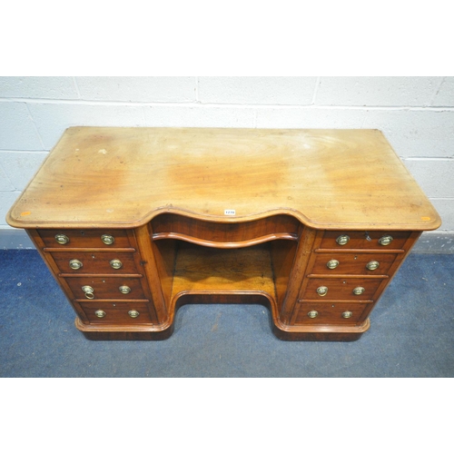 1196 - A VICTORIAN MAHOGANY KNEE HOLE DESK, serpentine centre, over a single frieze drawer, flanked by two ... 