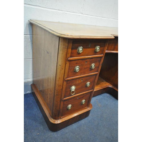 1196 - A VICTORIAN MAHOGANY KNEE HOLE DESK, serpentine centre, over a single frieze drawer, flanked by two ... 