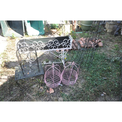 1007 - A QUANTITY OF METAL GARDEN ITEMS, to include a wrought iron rectangular planter on a stand, length 9... 