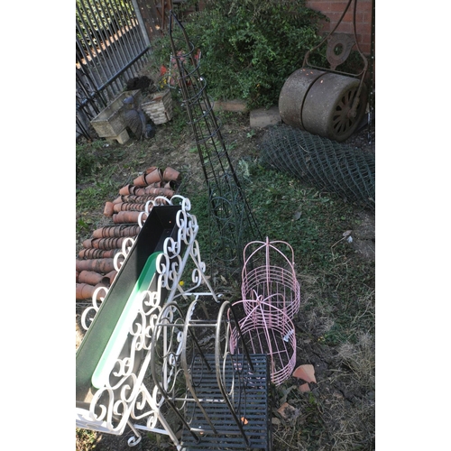 1007 - A QUANTITY OF METAL GARDEN ITEMS, to include a wrought iron rectangular planter on a stand, length 9... 