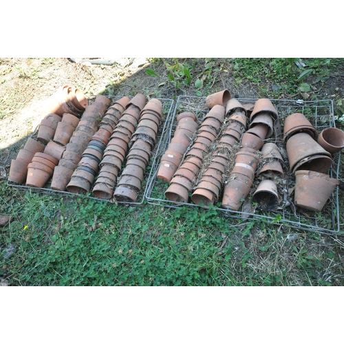 1008 - TWO TRAYS CONTAINING A QUANTITY OF TERRACOTTA PLANT POTS (condition:-mostly in poor condition, as cr... 