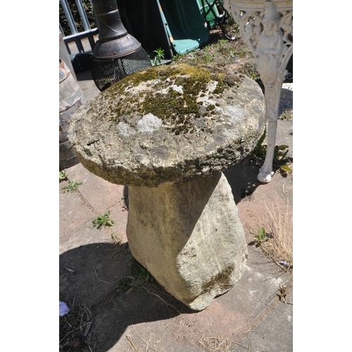 1011 - A COMPOSITE STADDLE STONE, with a weathered top, diameter 47cm x height 68cm