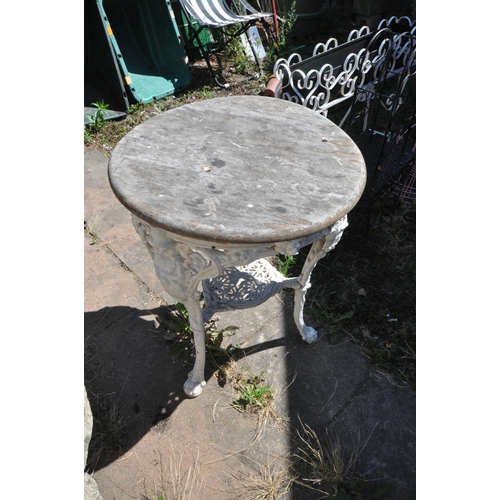 1012 - A CAST IRON PUB TABLE, with a weathered teak top, and a painted base, diameter 60cm x height 76cm