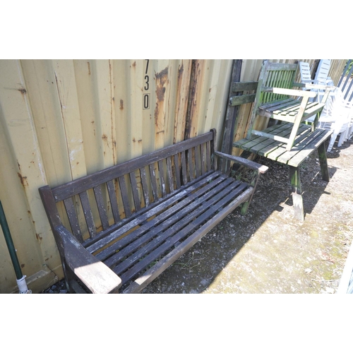 1018 - A WEATHER TEAK GARDEN TABLE AND BENCH (condition:-bench part loose and distressed) along with a simi... 