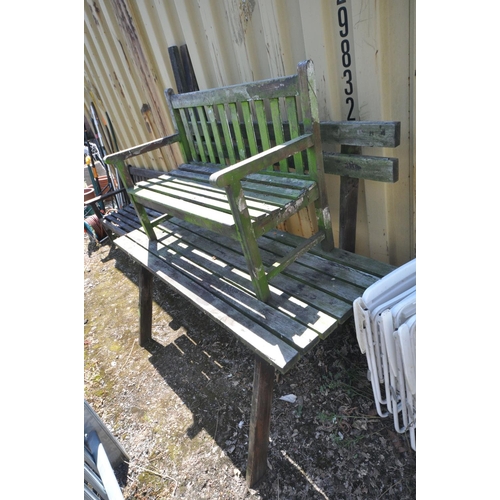 1018 - A WEATHER TEAK GARDEN TABLE AND BENCH (condition:-bench part loose and distressed) along with a simi... 