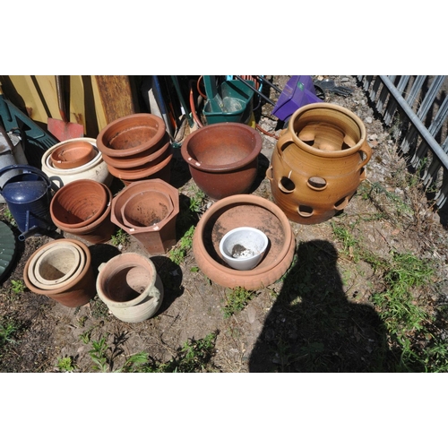 1020 - A SELECTION OF MOSTLY TERRACOTTA GARDEN PLANTERS, to include a strawberry/herb planter, a low campag... 