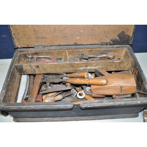 1055 - A WOODEN TOOLCHEST AND TOOLS to include a quantity of vintage tools, Record planes, wooden block pla... 