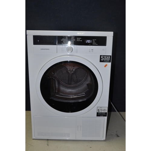 1075 - A GRUNDIG GTW27110GW 7KG CONDENSOR DRYER measuring width 60cm x depth 56cm x 84cm height (PAT pass a... 