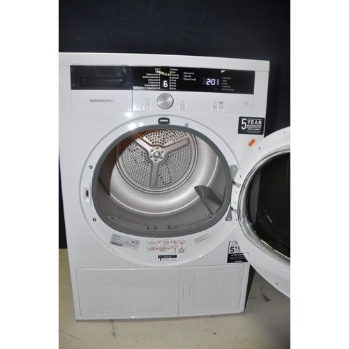 1075 - A GRUNDIG GTW27110GW 7KG CONDENSOR DRYER measuring width 60cm x depth 56cm x 84cm height (PAT pass a... 