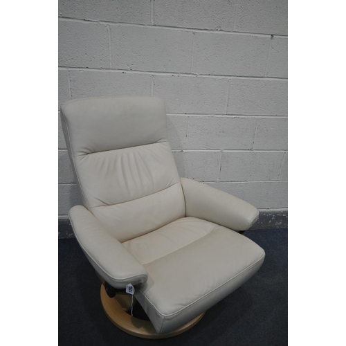 1202 - A CREAM LEATHER EKORNES STRESSLESS SWIVEL RECLINING ARMCHAIR, on a beech frame, and a matching foot ... 