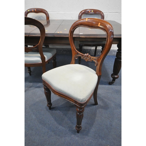 1205 - A VICTORIAN MAHOGANY WIND OUT DINING TABLE, with canted corners, two additional leaves, on fluted le... 