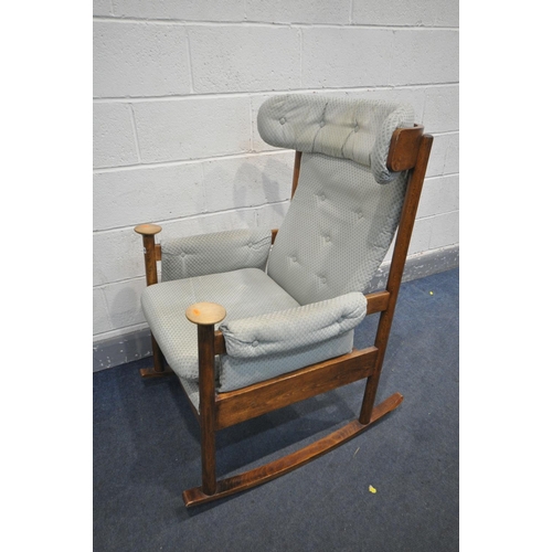 1209 - A MID CENTURY PARKER KNOLL MODEL PK 1031/4 TEAK ROCKING CHAIR (condition:-torn upholstered seat, and... 