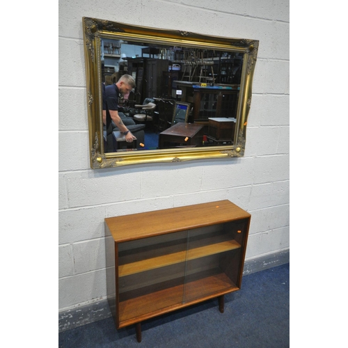 1231 - AN GILT FRAMED BEVELLED EDGE WALL MIRROR, 106cm x 75cm, an oval mahogany coffee table, and a mid-cen... 