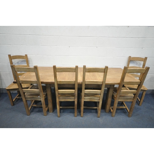 1232 - A SOLID OAK EXTENDING DINING TABLE, with two additional leaves, open length 226cm x closed 150cm x d... 