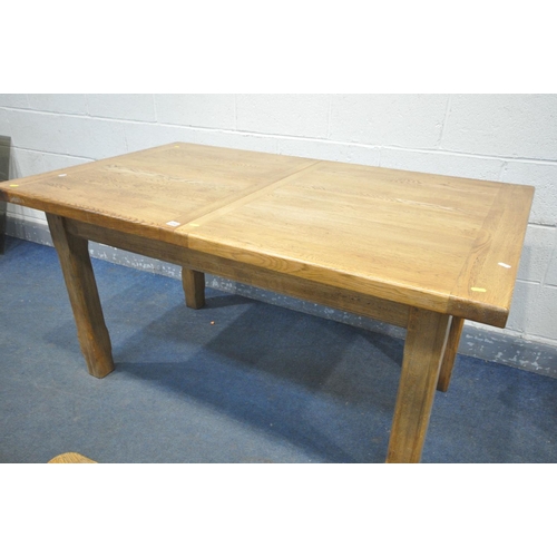 1232 - A SOLID OAK EXTENDING DINING TABLE, with two additional leaves, open length 226cm x closed 150cm x d... 