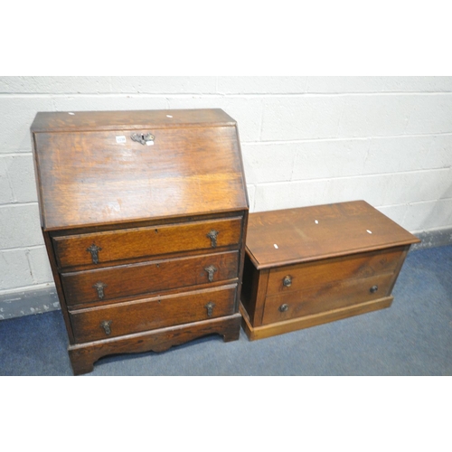 1238 - AN OAK FALL FRONT BUREAU, with fitted interior, above three graduated drawers, width 74cm x depth 44... 