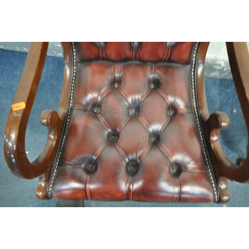 1245 - A MAHOGANY SWIVEL OFFICE CHAIR, with red buttoned leather