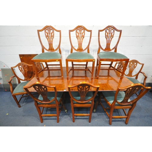 1248 - A YEW WOOD TWIN PEDESTAL DINING TABLE, with two additional leaves, open length 251cm x closed length... 