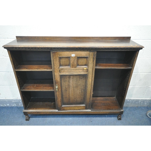 1256 - AN EARLY TO MID 20TH CENTURY OAK SIDE BY SIDE BOOKCASE, with a raised back, a single central door, a... 