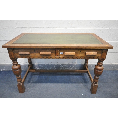 1257 - A 20TH CENTURY SOLID OAK WRITING DESK, with green leather inlay, two frieze drawers, on acorn legs, ... 