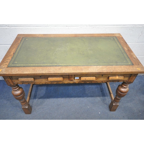 1257 - A 20TH CENTURY SOLID OAK WRITING DESK, with green leather inlay, two frieze drawers, on acorn legs, ... 