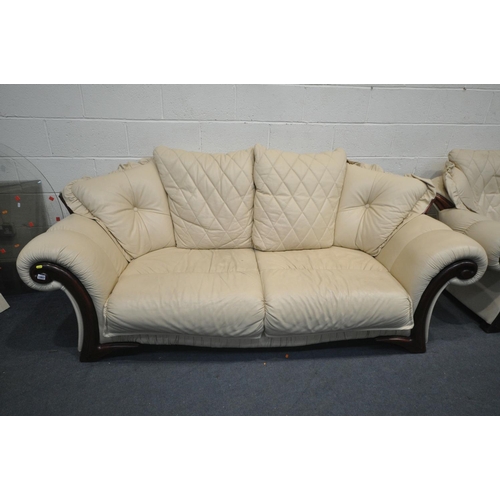 1267 - A CREAM LEATHER THREE PIECE LOUNGE SUITE, comprising a sofa, length 225cm x depth 95cm x height 93cm... 