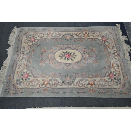 1268 - A GREEN WOOLLEN CHINESE RUG, 183cm x 123cm , two smaller Chinese rugs, and another rug (4)