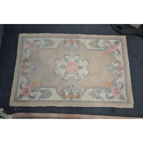 1268 - A GREEN WOOLLEN CHINESE RUG, 183cm x 123cm , two smaller Chinese rugs, and another rug (4)