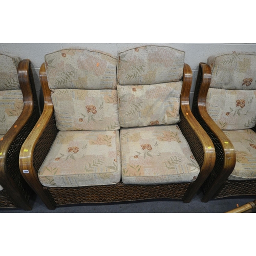 1269 - A FIVE PIECE WICKER CONSERVATORY SUITE, comprising a two seater sofa, a pair of armchairs, a pouffe,... 