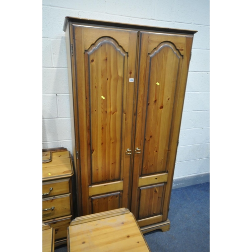 1280 - A PINE BEDROOM SUITE, comprising a double door wardrobe, width 90cm x depth 55cm x height 181cm, a d... 