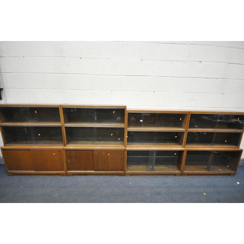 1285 - FOUR MID CENTURY MINTY TEAK SECTIONAL BOOKCASE, to include four bases, with twelve sections in total... 