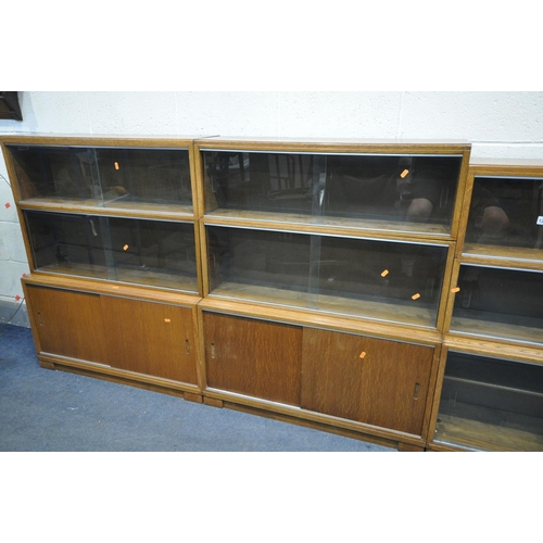 1285 - FOUR MID CENTURY MINTY TEAK SECTIONAL BOOKCASE, to include four bases, with twelve sections in total... 