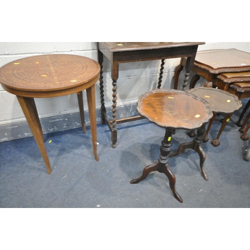 1299 - A 20TH CENTURY BURR WALNUT SERPENTINE NEST OF THREE TABLES, with glass inserts, largest length 60cm ... 