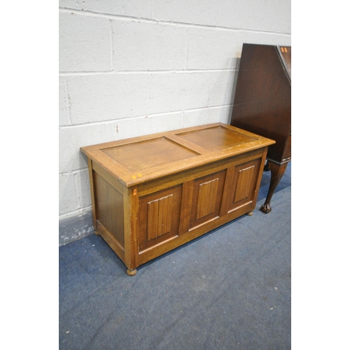 1326 - AN OAK LINENFOLD BLANKET CHEST, width 98cm x depth 44cm x height 53cm, and a mahogany bureau on cabr... 