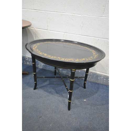 1332 - AN EBONISED AND FLORAL GILT OVAL OCCASIONAL TABLE, with a removable tray, on a faux bamboo base, wid... 