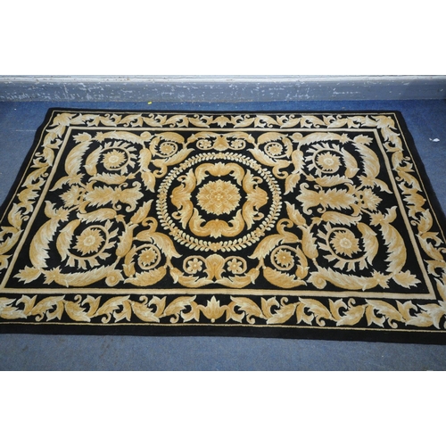 1339 - A G H FRITH WOOLLEN BLACK AND GOLD CHINESE RUG, 245cm X 152cm