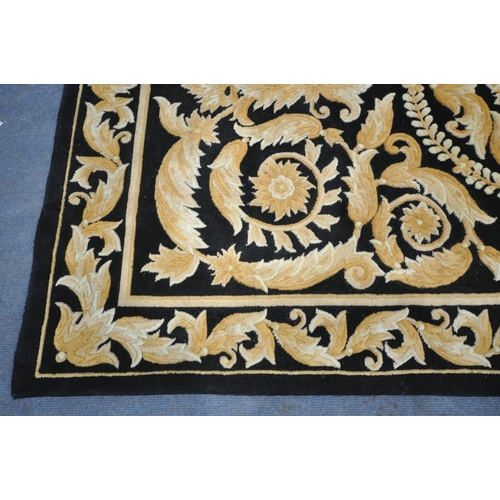 1339 - A G H FRITH WOOLLEN BLACK AND GOLD CHINESE RUG, 245cm X 152cm