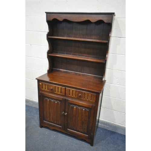 1349 - AN OAK LINENFOLD DRESSER, with two drawers, width 96cm x depth 46cm x height 179cm