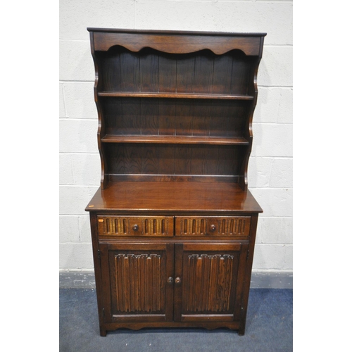 1349 - AN OAK LINENFOLD DRESSER, with two drawers, width 96cm x depth 46cm x height 179cm