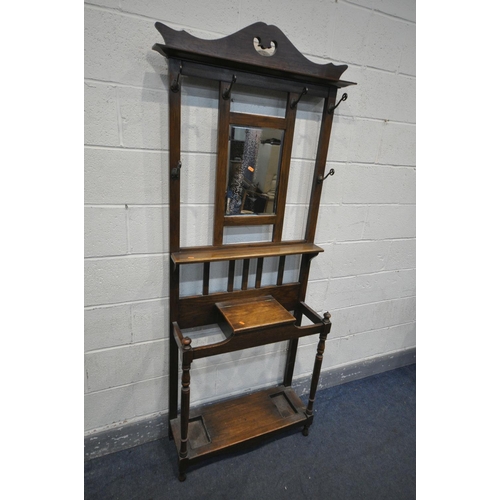 1350 - AN EDWARDIAN OAK HALL STAND, with six hooks flanking a bevelled mirror, width 76cm x depth 28cm x 20... 