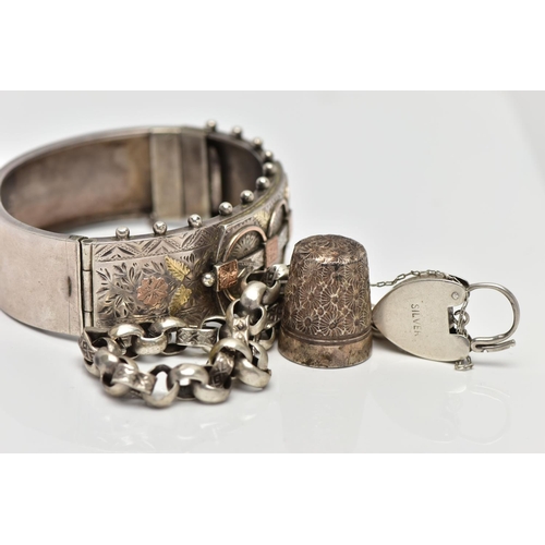 10 - A LATE VICTORIAN SILVER HINGED BANGLE, 'CHARLES HORNER' THIMBLE AND A BRACELET, the bangle decorated... 