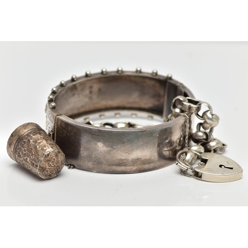 10 - A LATE VICTORIAN SILVER HINGED BANGLE, 'CHARLES HORNER' THIMBLE AND A BRACELET, the bangle decorated... 